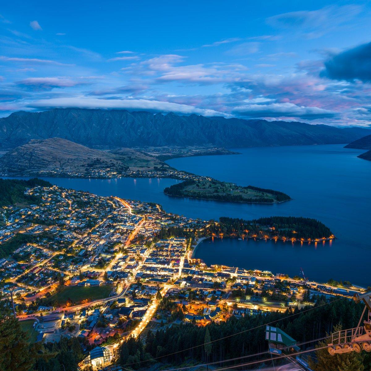 Blue hour aerial view of a lakeside town, captured at 100MP for large-format printing